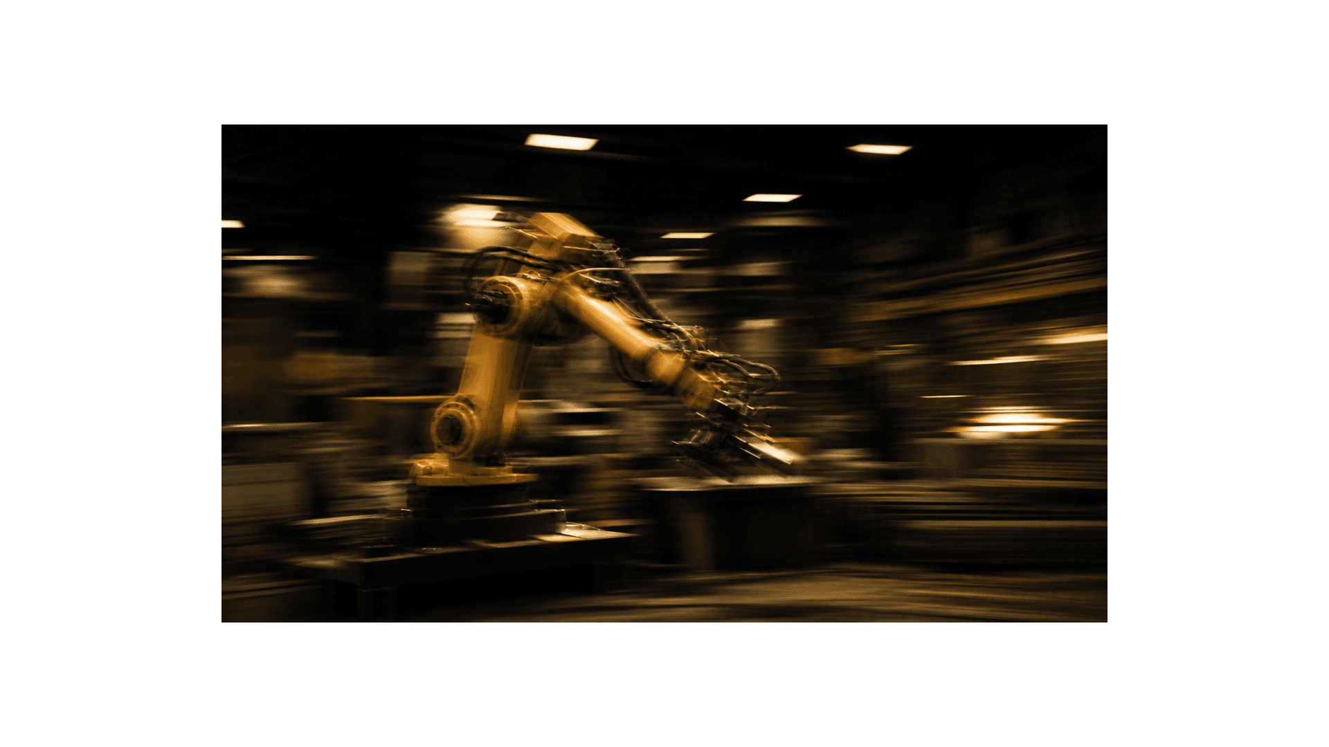Industrial robotic arm in motion on a factory floor